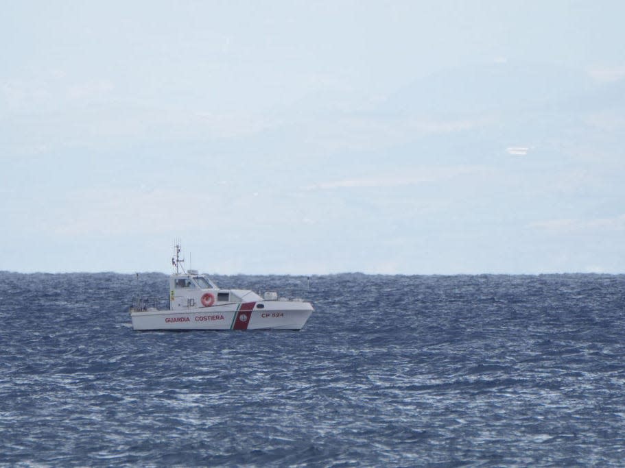 An emergency service boat is surrounded by sea off the coast of Sicily.