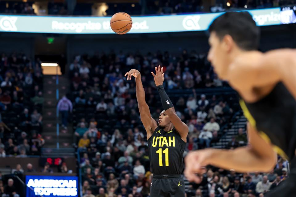 Utah Jazz guard <a class="link " href="https://sports.yahoo.com/nba/players/5636" data-i13n="sec:content-canvas;subsec:anchor_text;elm:context_link" data-ylk="slk:Kris Dunn;sec:content-canvas;subsec:anchor_text;elm:context_link;itc:0">Kris Dunn</a> (11) shoots during the game against the Memphis Grizzlies at the Delta Center in Salt Lake City on Wednesday, Nov. 1, 2023. | Spenser Heaps, Deseret News