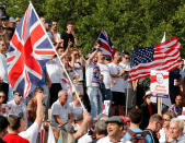 <p>Demonstrators hold banners supporting English Defense League founder Tommy Robinson and President Trump during a rally in London, July 14, 2018. (Photo: Yves Herman/Reuters) </p>