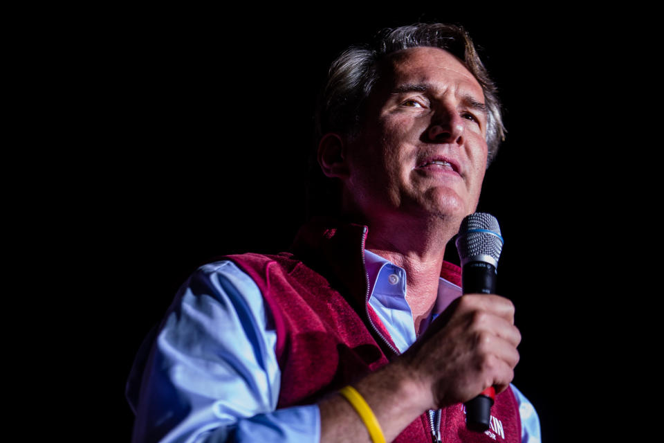 Glenn Youngkin holding a microphone during a rally on Saturday in Henrico, Virginia. 