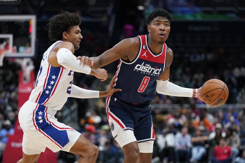 Washington Wizards forward Rui Hachimura, right, of Japan, drives the ball past Philadelphia 76ers guard Matisse Thybulle in the first half of an NBA basketball game, Monday, Oct. 31, 2022, in Washington. (AP Photo/Patrick Semansky)