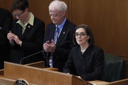 Oregon Governor Kate Brown speaks after being sworn in at the state capital building in Salem, Oregon February 18, 2015. REUTERS/Steve Dipaola