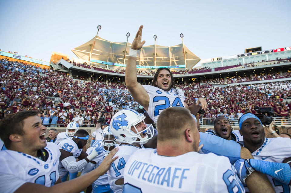 <p>Players from North Carolina hoist kicker Nick Weiler on their shoulders after Weiler kicked the game winning 54-yard field goal against Florida State in an NCAA college football game in Tallahassee, Fla., Oct. 1, 2016. North Carolina defeated Florida State 37-35. (Photo: Mark Wallheiser/AP)</p>