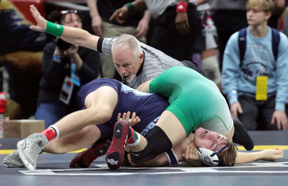Tristan McKibben of Rootstown, bottom, has a hold applied to him by Skyler King of Barnesville during their 157-pound Division III quarterfinal match in the 2024 OHSAA State Wrestling Tournament, Saturday, March 9, 2024, in Columbus.