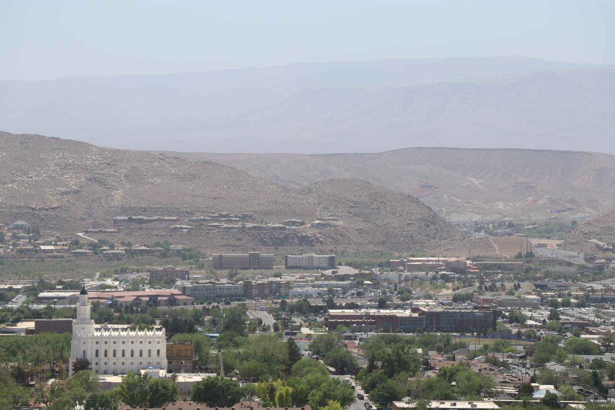 Wind-raised dust hovers over downtown St. George as seen from a vantage point on Red Hills Parkway. Concerns over air quality have increased in recent years with Utah's rising population and new development.