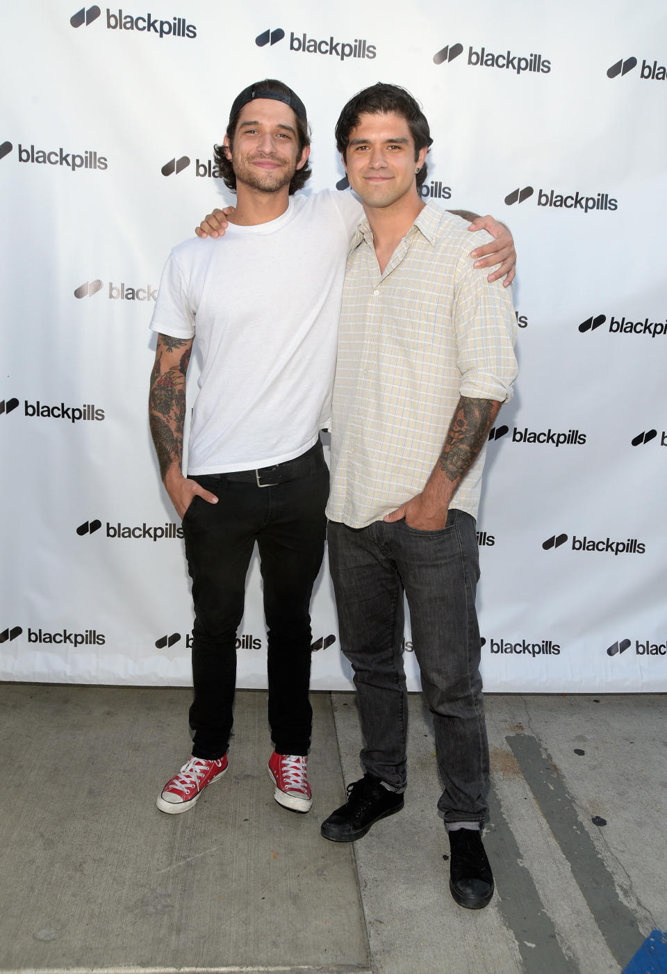 the brothers posing at an event