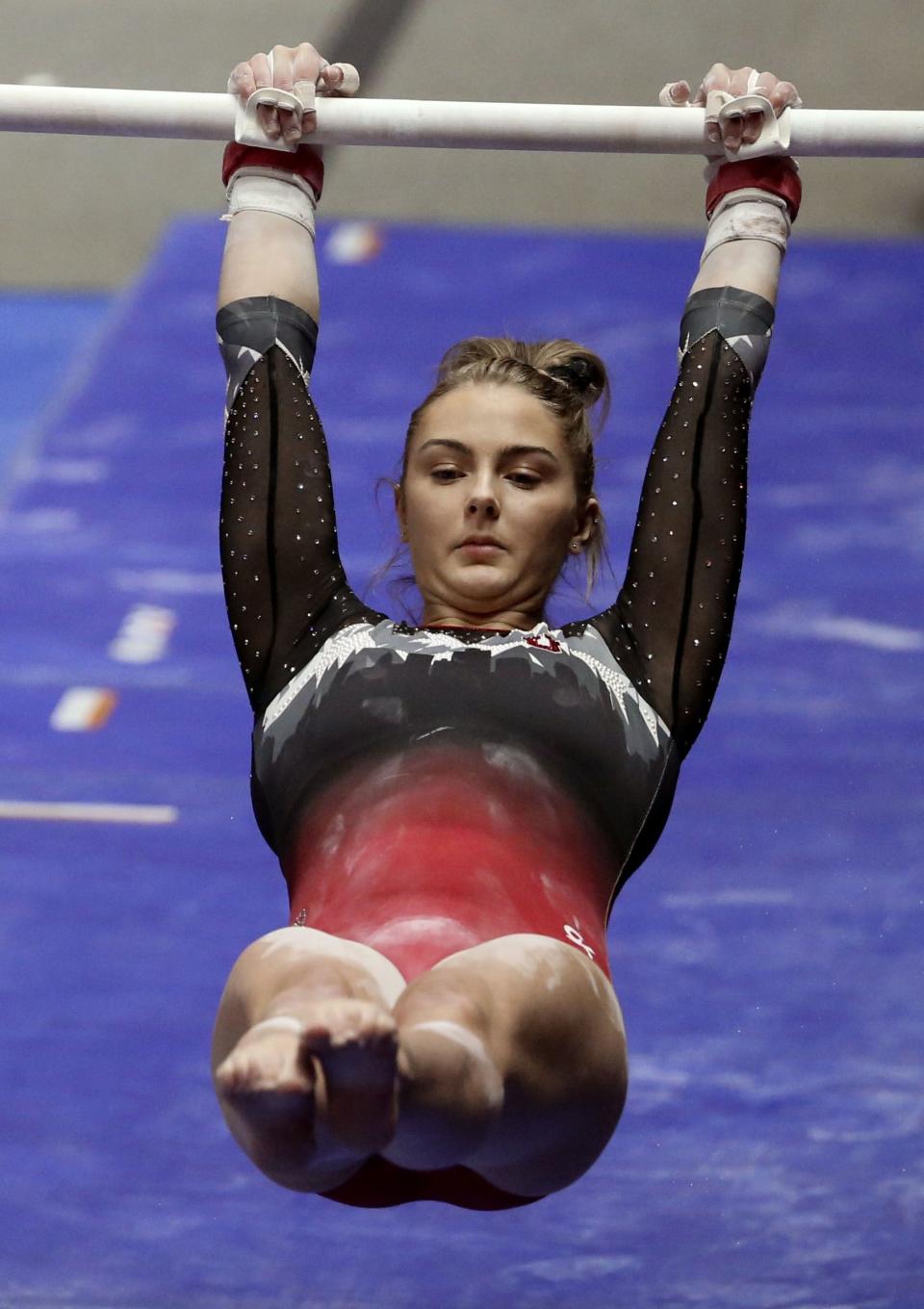 Lucy Stanhope performs on the bars during the annual Red Rocks Preview at the University of Utah’s Jon M. Huntsman Center in Salt Lake City on Wednesday, Dec. 16, 2020. | Laura Seitz, Deseret News