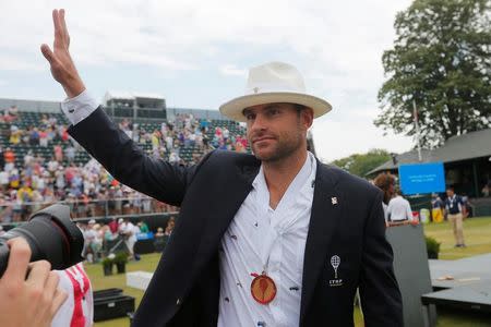 Andy Roddick of the U.S. acknowledges fans as he walks around center court after being inducted into the International Tennis Hall of Fame in Newport, Rhode Island, U.S., July 22, 2017. REUTERS/Brian Snyder