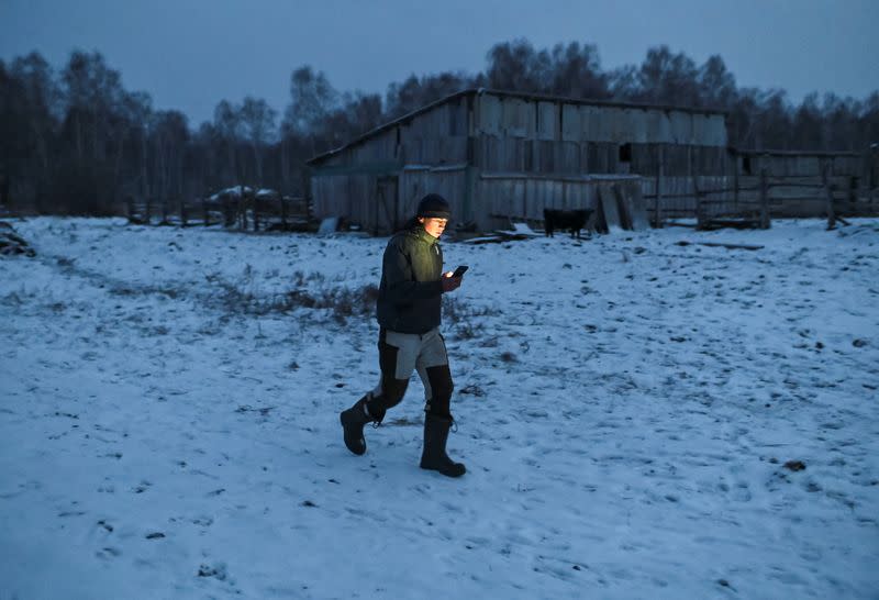 Russian student and blogger climbs a tree for better celular internet connection in his remote Siberian village of Stankevichi