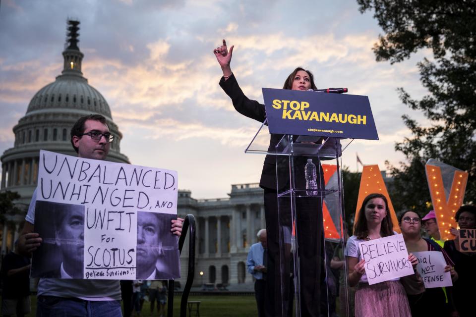 Senator Kamala Harris speaks to protestors rallying against Supreme Court nominee Judge Brett Kavanaugh on Capitol Hill after allegations of sexual assault emerge against him. (Getty)