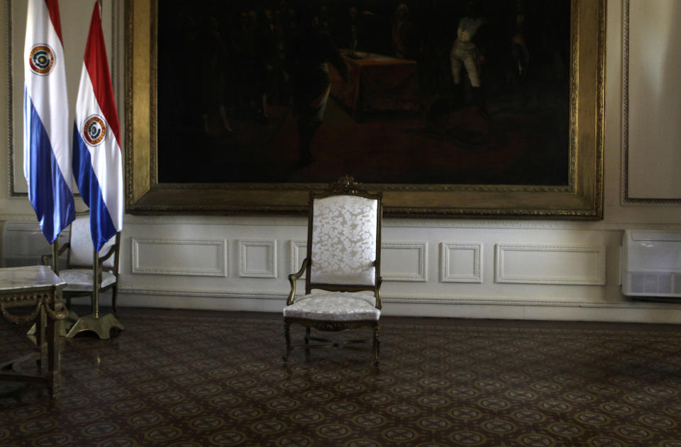 The presidential chair sits empty before the start of a news conference by Paraguay's new President Federico Franco at the presidential palace in Asuncion, Paraguay, Saturday, June 23, 2012. Former President Fernando Lugo's ouster by lawmakers on Friday has been widely condemned in Latin America as Franco is promising to honor foreign commitments and reach out to Latin American leaders to try to keep his country from becoming a regional pariah. (AP Photo/Jorge Saenz)
