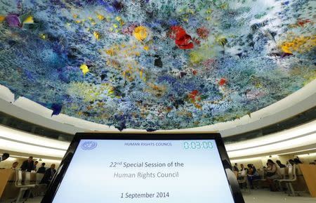 A TV screen is pictured before a special session of the Human Rights Council on Iraq at the United Nations Europeans headquarters in Geneva September 1, 2014. REUTERS/Denis Balibouse