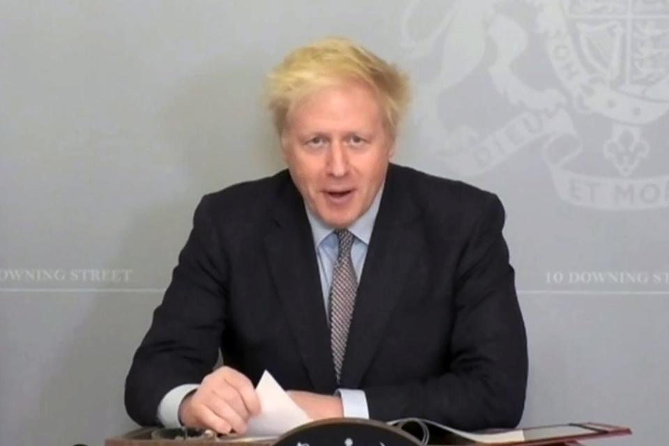 <p>Britain’s Prime Minister Boris Johnson as he takes part remotely in Prime Minister’s Questions</p> (PRU/AFP via Getty Images)