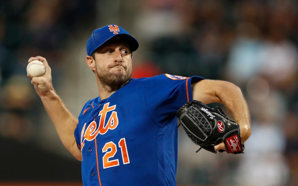 New York Mets starting pitcher Max Scherzer throws against the Washington Nationals during the first inning of a baseball game Saturday, Sept.  3, 2022, in New York