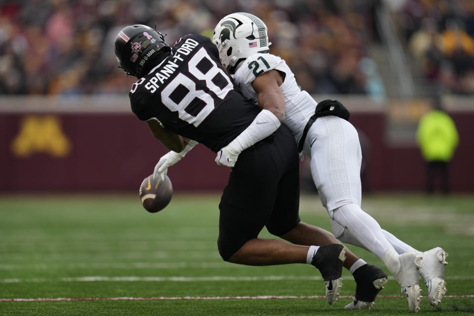 Michigan State defensive back Dillon Tatum (21) breaks up a pass intended for Minnesota tight end Brevyn Spann-Ford (88) during the first half of an NCAA college football game Saturday, Oct. 28, 2023, in Minneapolis. Tatum was called for pass interference on the play. (AP Photo/Abbie Parr)