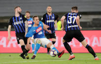 Soccer Football - Serie A - Napoli v Inter Milan - Stadio San Paolo, Naples, Italy - May 19, 2019 Napoli's Arkadiusz Milik in action with Inter Milan's Marcelo Brozovic and Milan Skriniar REUTERS/Ciro De Luca