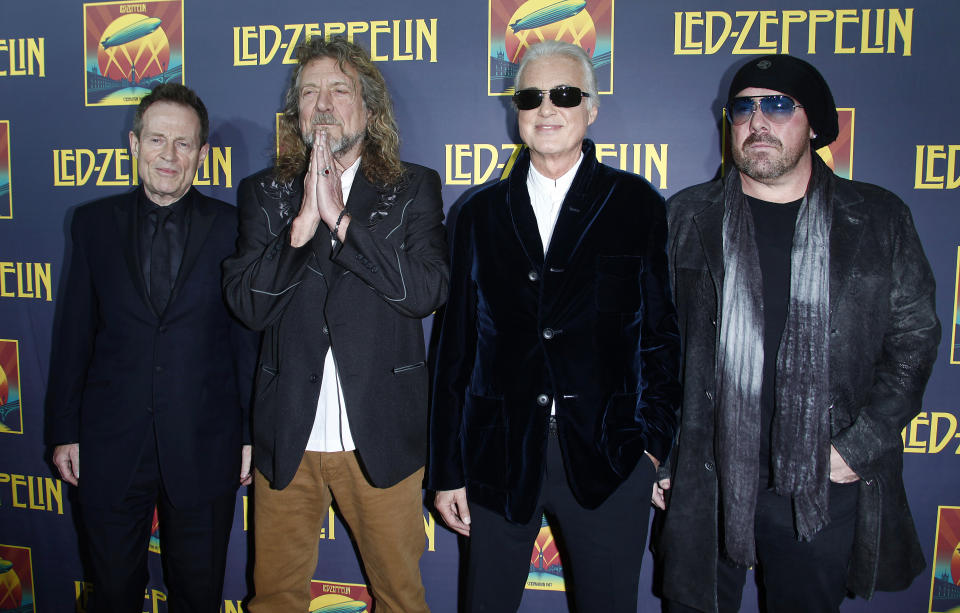 Members of British rock band Led Zeppelin (L-R) bass player John Paul Jones, lead singer Robert Plant, guitarist Jimmy Page and drummer Jason Bonham, who replaces the band's original drummer his father John Bonham, arrive for the premiere of their film 