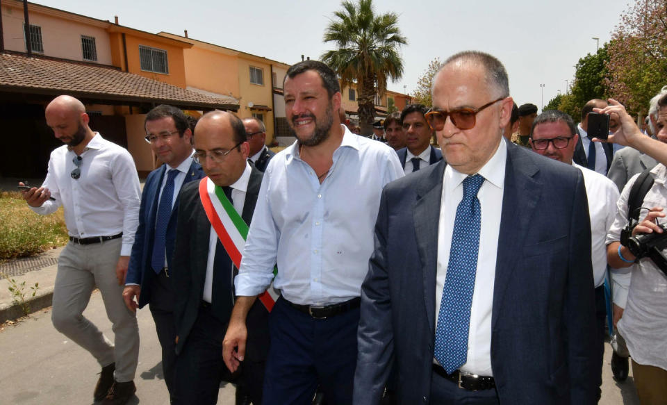 Italian Deputy Premier and Interior Minister, Matteo Salvini, arrives in Mineo, near Catania, southern Italy, Tuesday, July 9, 2019. Italy's hard-line interior minister has closed a migrant center in Sicily that he says was the largest in Europe as he underlined the decrease in migrant arrivals since he took over a year ago. Matteo Salvini has told reporters in Mineo, Sicily that that the number of migrants in centers is down from 182,000 a year ago to 107,000 now. (Orietta Scardino/ANSA via AP)