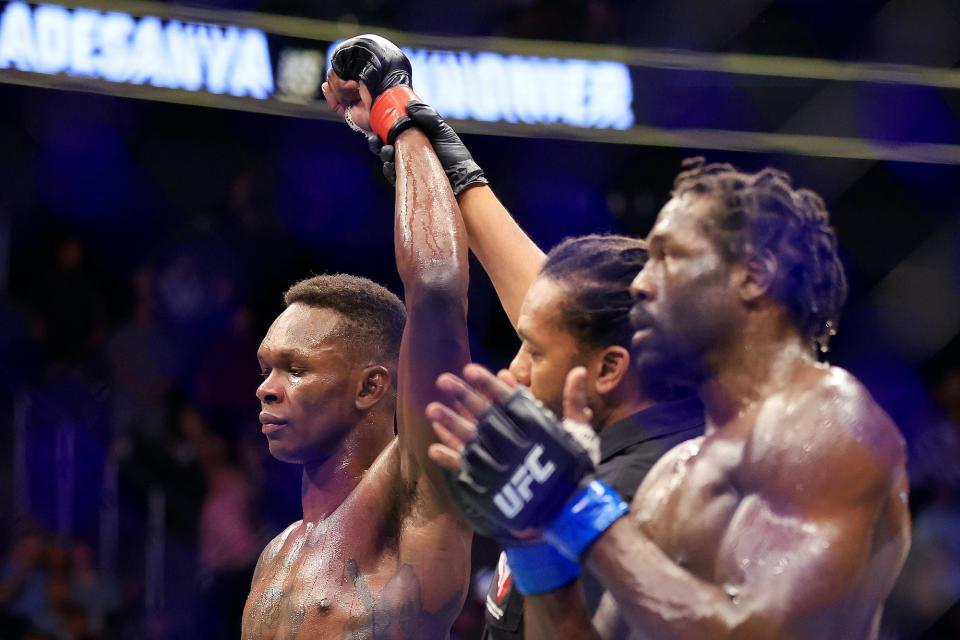 Israel Adesanya celebrates his win over Jared Cannonier.