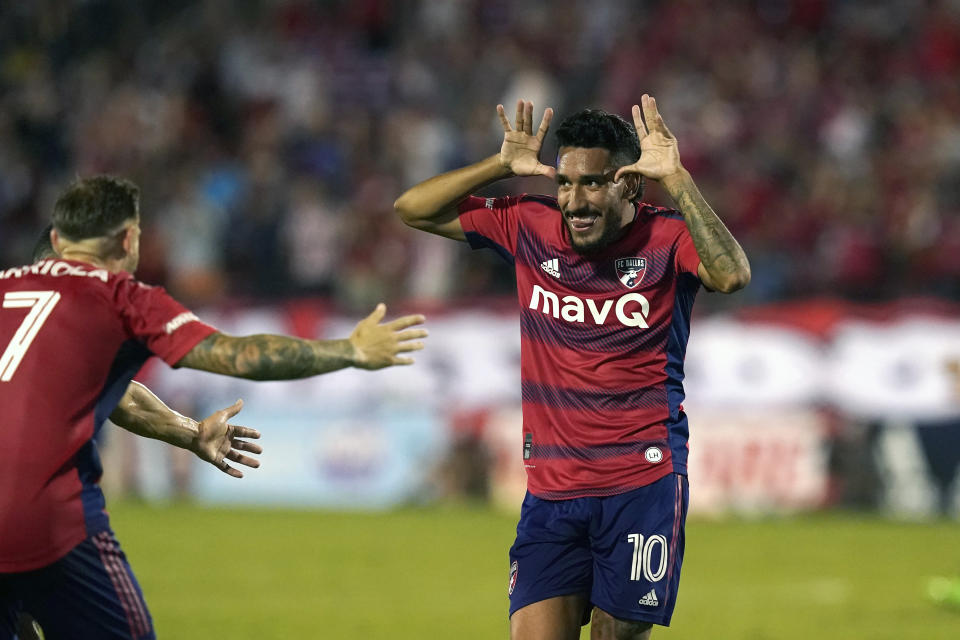 FC Dallas forward Jesús Ferreira (10) celebrates his goal with Paul Arriola (7) and other teammates during the first half of an MLS soccer match against the Philadelphia Union on Wednesday, Aug. 17, 2022, in Frisco, Texas. (AP Photo/LM Otero)