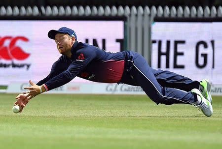 Cricket - ODI - New Zealand vs England - Seddon Park, Hamilton, New Zealand, February 25, 2018. England's Jonny Bairstow dives but fails to take a catch during the one-day international match. REUTERS/Ross Setford