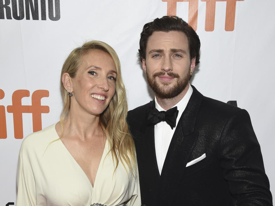 FILE - In this Sept. 6, 2018 file photo, director Sam Taylor-Johnson, left, and her actor husband Aaron Taylor-Johnson attend the gala for "Outlaw King" at the Toronto International Film Festival in Toronto. James Frey’s “A Million Little Pieces,” once one of the most toxic properties in Hollywood, has been reborn on the big screen thanks to director Sam Taylor-Johnson and her husband, whom she wrote it with. (Photo by Evan Agostini/Invision/AP, File)