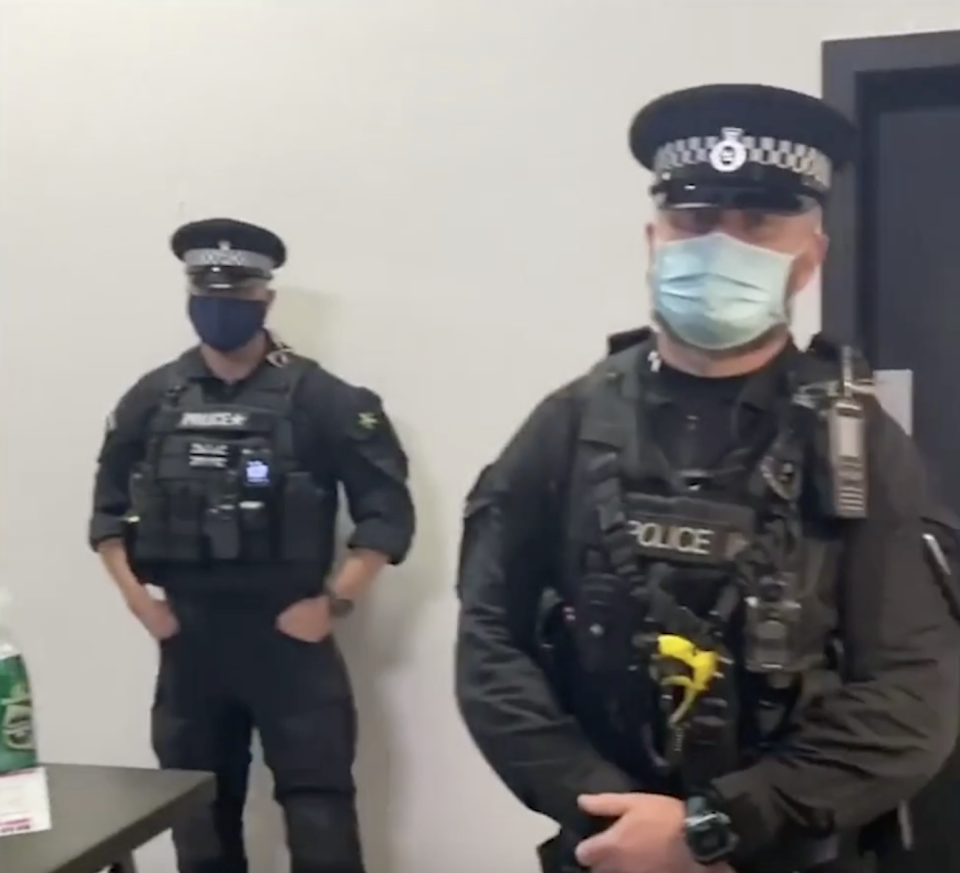 Police are seen in the video as officers ordered the gym to shut. (Instagram/nickcapo_)