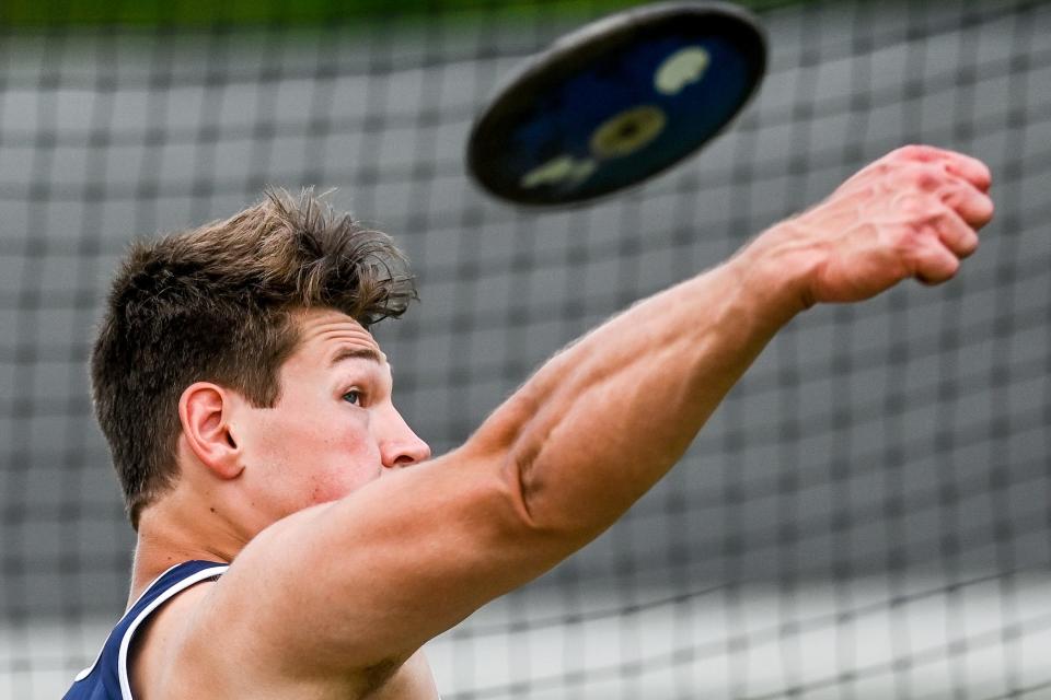 Mason's Connor Williamson competes in the discus throw event during the regional track meet on Friday, May 20, 2022, at Mason High School.