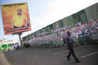 A man walks past posters of primaries elections candidates in the city of Kisumu, Kenya April 19, 2017. REUTERS/Baz Ratner