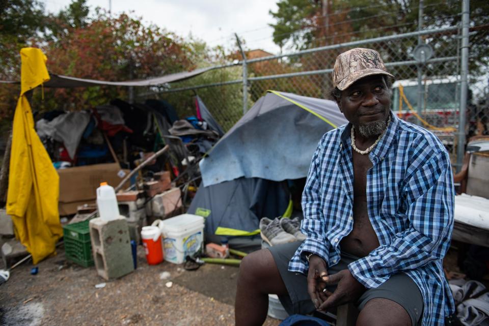 Slyzale Peters, 45, poses for a photo outside his tent near downtown Jackson on Friday, Nov. 17. Peters said he has stayed there for nine months and tries to help other people out by sharing food and by storing belongings.