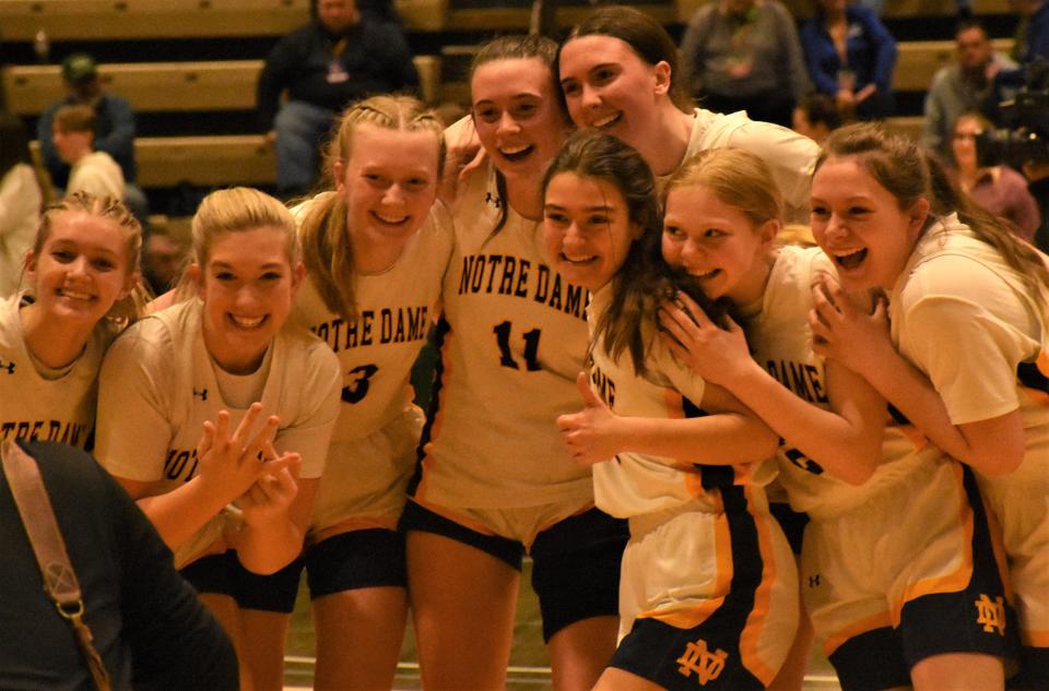 Utica's Notre Dame Jugglers pose for a photo after beating the Albany Academy fo Girls in the NYSPHSAA's Class B championship game  at Hudson Valley Community College in Troy.