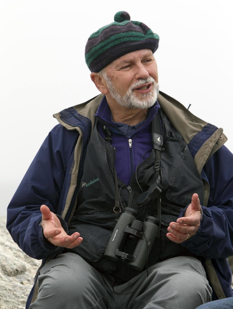 In this July 3, 2013, photo, Dr. Steve Kress talks on Eastern Egg Rock, a 7-acre island where he led the successful effort to re colonize puffins off the Maine coast. Forty years ago Kress and his team of researchers began transplanting puffin chicks from Newfoundland to man-made burrows on the remote island in Muscongus Bay. (AP Photo/Robert F. Bukaty)