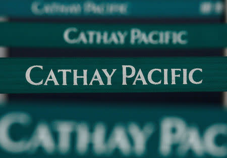 Belts are seen in front of a Cathay Pacific Airways check-in counter at the Hong Kong Airport March 11, 2009. REUTERS/Bobby Yip/File Photo