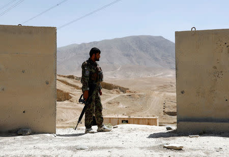 An Afghan National Army (ANA) soldier keeps watch at a checkpoint on the Ghazni highway, in Maidan Shar, the capital of Wardak province, Afghanistan August 12, 2018. REUTERS/Mohammad Ismail