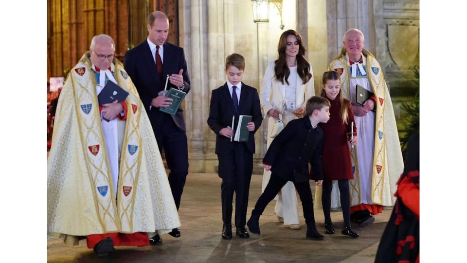 Prince Louis blowing out Princess Charlotte's candle