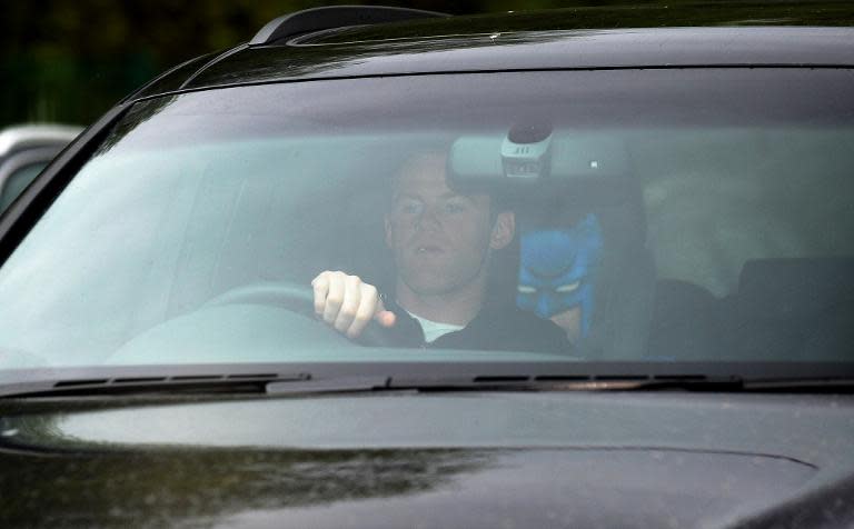 Manchester United's English striker Wayne Rooney arrives at Manchester United's training ground at Carrington in Manchester, north west England on April 22, 2014