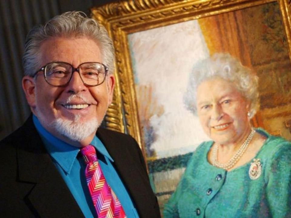 Rolf Harris with his portrait of Queen Elizabeth II (Danny Lawson/PA)