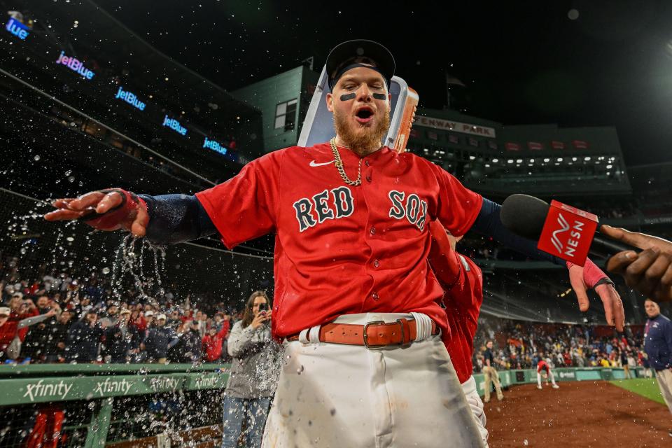 Alex Verdugo gets doused after a walk-off home run against the Blue Jays.