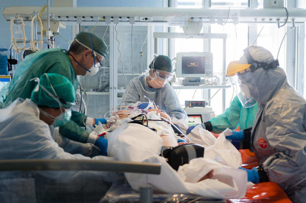 CREMONA, ITALY - MARCH 29: (EDITORIAL USE ONLY) Nurses prepare a patient for transport at Cremona Hospital on March 29, 2020 in Cremona, Italy. The Italian government continues to enforce the nationwide lockdown measures to control the spread of coronavirus / COVID-19. (Photo by Marco Mantovani/Getty Images)