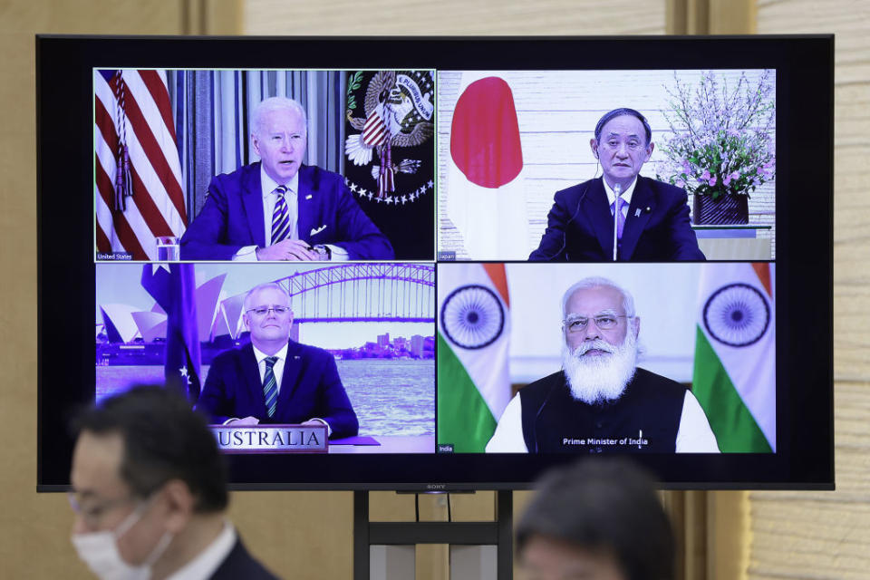 U.S. President Joe Biden, top left, Yoshihide Suga, Japan's prime minister, top right, Scott Morrison, Australia's prime minister, bottom left, and Narendra Modi, India's prime minister, on a monitor during the virtual Quadrilateral Security Dialogue (Quad) meeting at Sugas official residence in Tokyo, Japan, on Friday, March 12, 2021. 