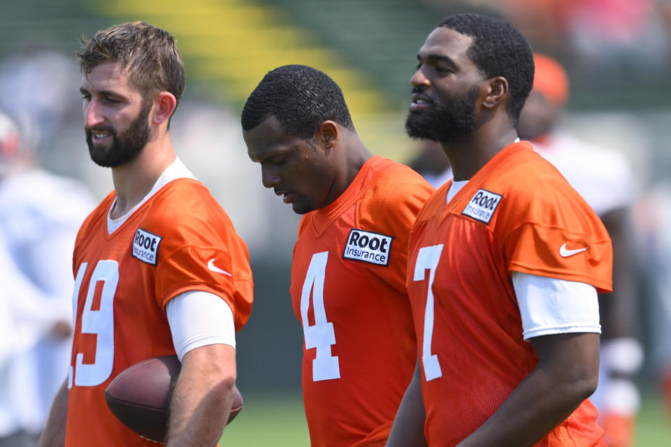 Cleveland Browns quarterbacks Josh Rosen (19), Deshaun Watson (4) and Jacoby Brissett (7) walk on the field during the NFL football team's training camp Wednesday, Aug. 3, 2022, in Berea, Ohio. (AP Photo/David Richard)