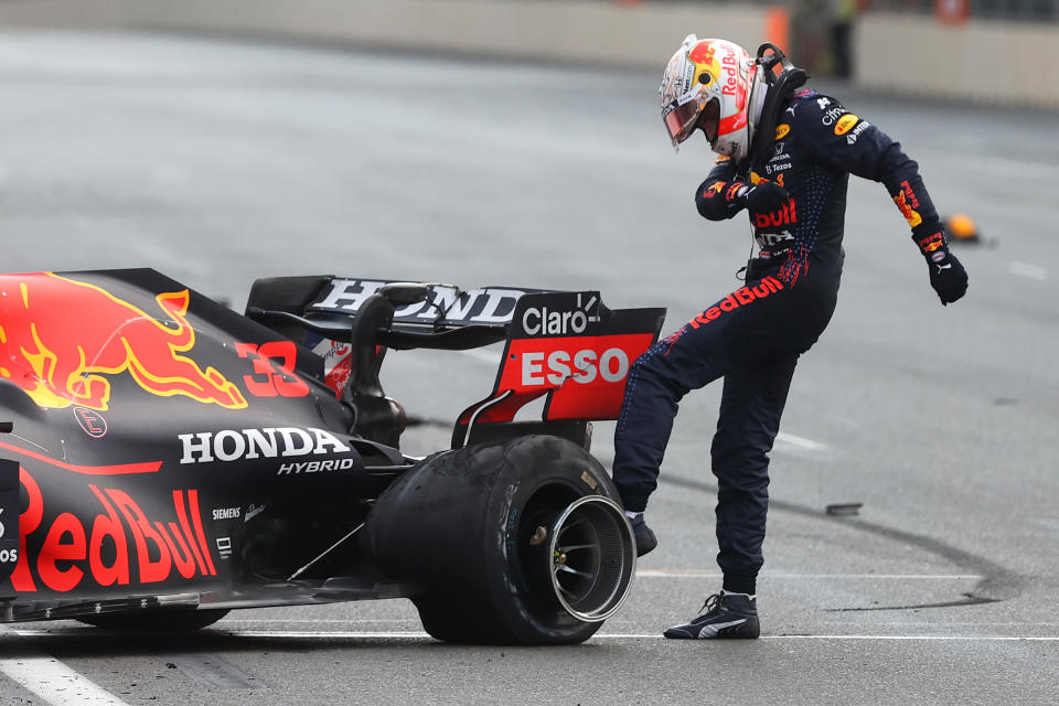 BAKU, AZERBAIJAN - JUNE 06: Max Verstappen of Netherlands and Red Bull Racing kicks his tyre as he reacts after crashing during the F1 Grand Prix of Azerbaijan at Baku City Circuit on June 06, 2021 in Baku, Azerbaijan. (Photo by Clive Rose/Getty Images)