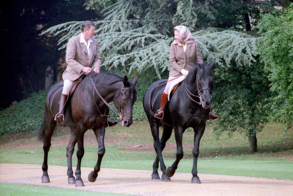 <p>The Queen on horseback with US president Ronald Reagan at Windsor Castle on 8 June 1982. (Reuters)</p> 