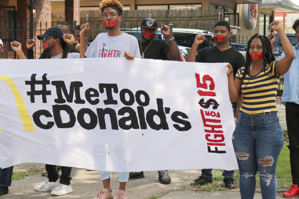 Current and former McDonald's employees wear tape with "#MeToo" over their mouths as they up to one of their restaurants for a protest in New Orleans on Tuesday, Sept. 18, 2018. McDonald’s workers staged protests in several cities Tuesday as part of what organizers billed as the first multistate strike seeking to combat sexual harassment in the workplace. (AP Photo/Janet McConnaughey)