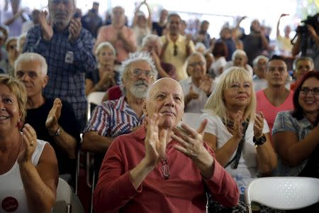 Supporters of leftist Syriza party react at the party's main election kiosk after the announcement of the first exit polls in Athens, Greece, September 20, 2015. REUTERS/Alkis Konstantinidis