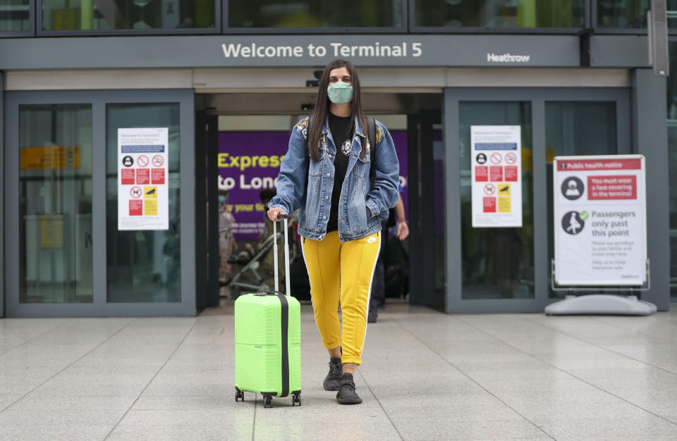 Celia Gonzalez arrives at Heathrow Airport's Terminal 5, after people returning from Spain were told they must quarantine when they return home.