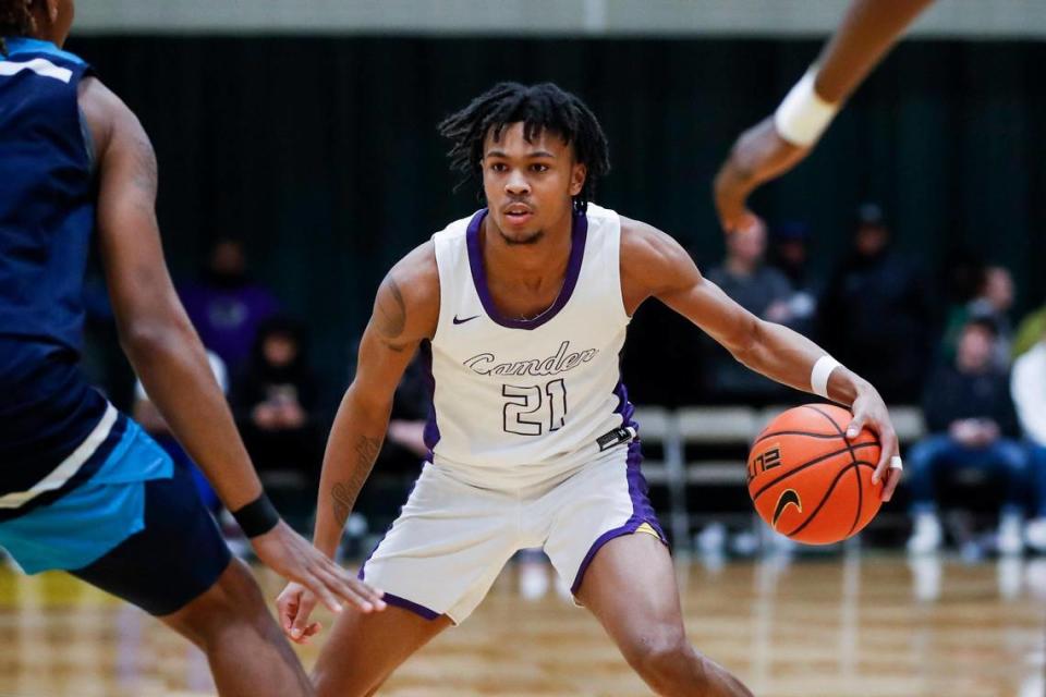 Camden (N.J.) High School senior guard and Kentucky men’s basketball 2023 signee DJ Wagner (21) dribbles the ball against Combine Academy (N.C.) during a game at the William Exum Center at Kentucky State University in Frankfort on Feb. 3.