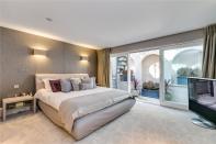 <p>One of the four bedrooms, which opens up on to a secluded private breakfast terrace. </p>