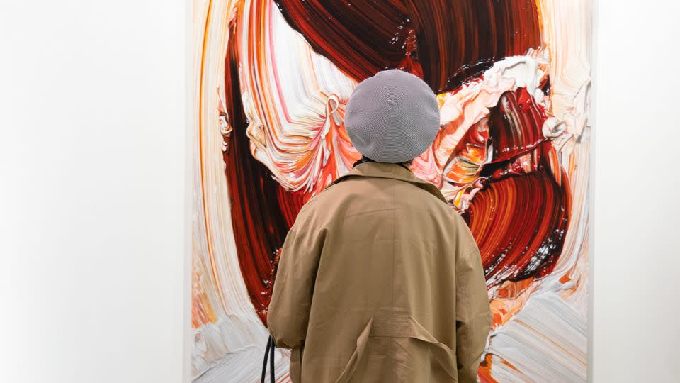 A visitor looks at Japanese artist Teppei Takeda's “Painting of Painting 046” at Maho Kubota gallery's booth. - Noemi Cassanelli/CNN