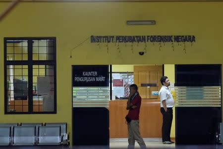 Hospital staffs gather at the morgue at Kuala Lumpur General Hospital where Kim Jong Nam's body is held for autopsy in Malaysia February 17, 2017. REUTERS/Athit Perawongmetha